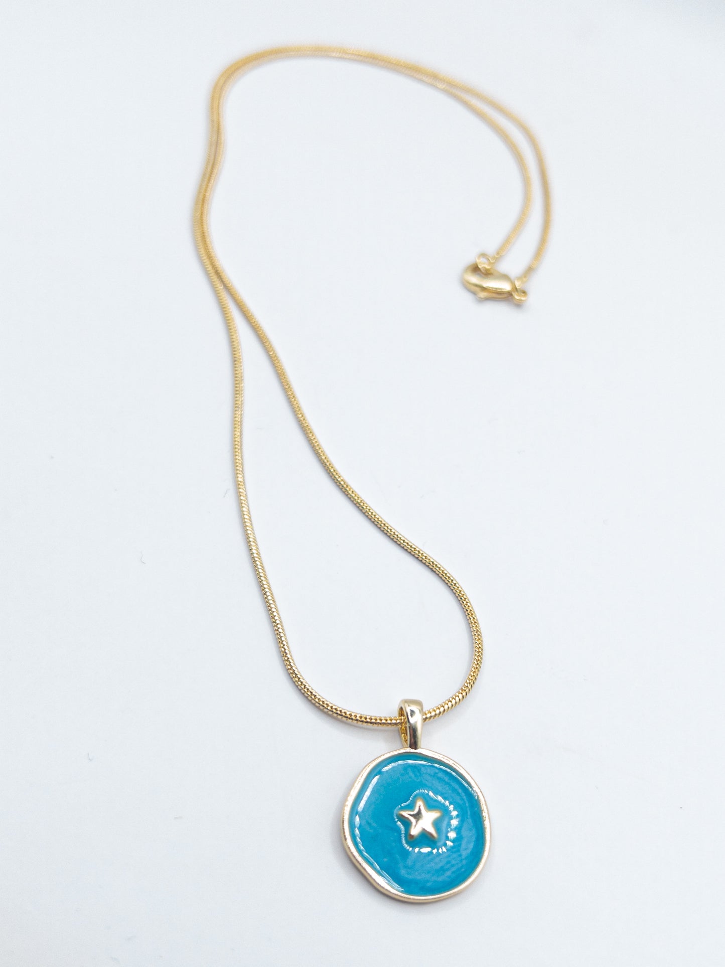 Ronde ketting goldplated met hanger blauw met ster