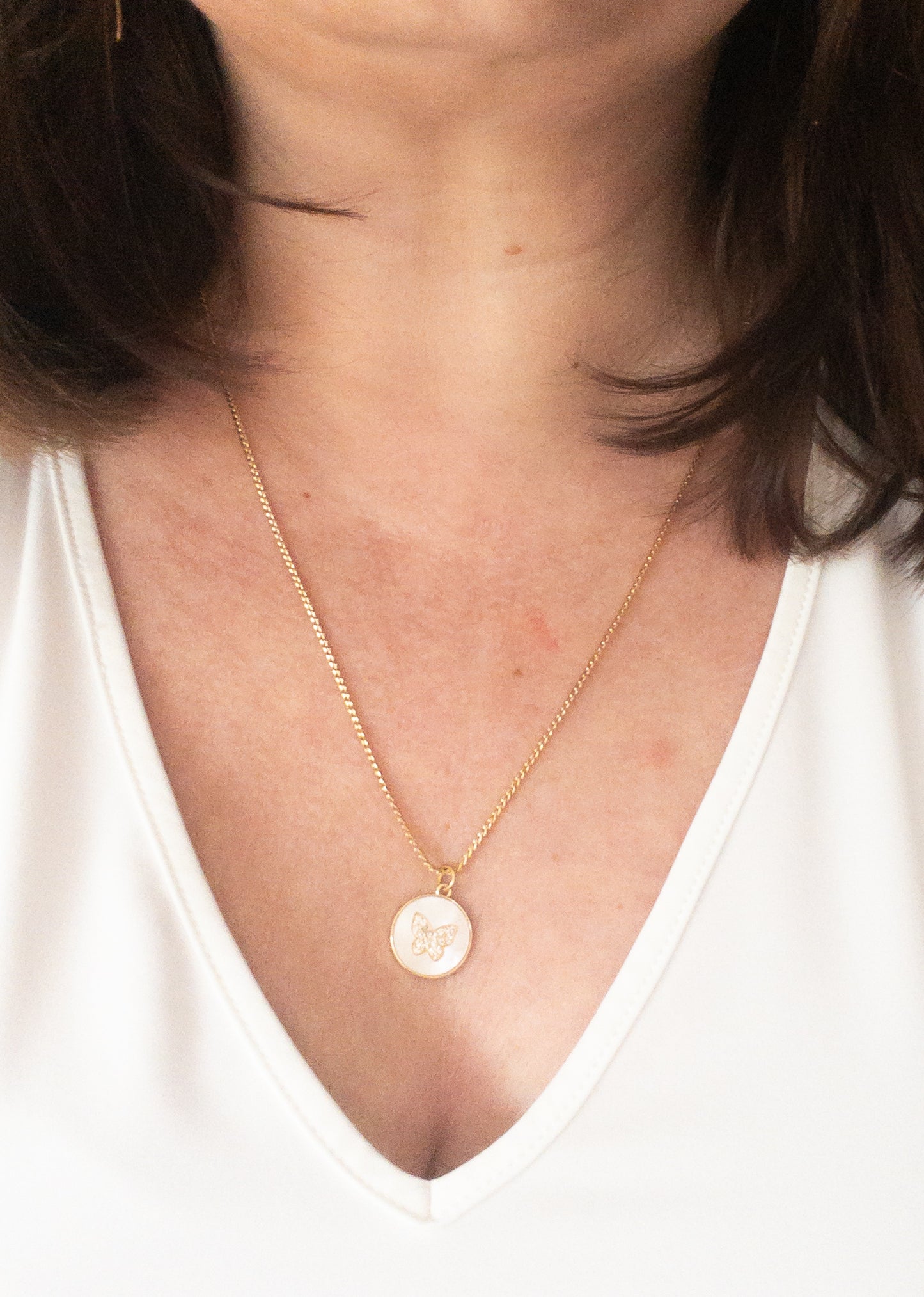 Ketting met vlinderhanger wit goud