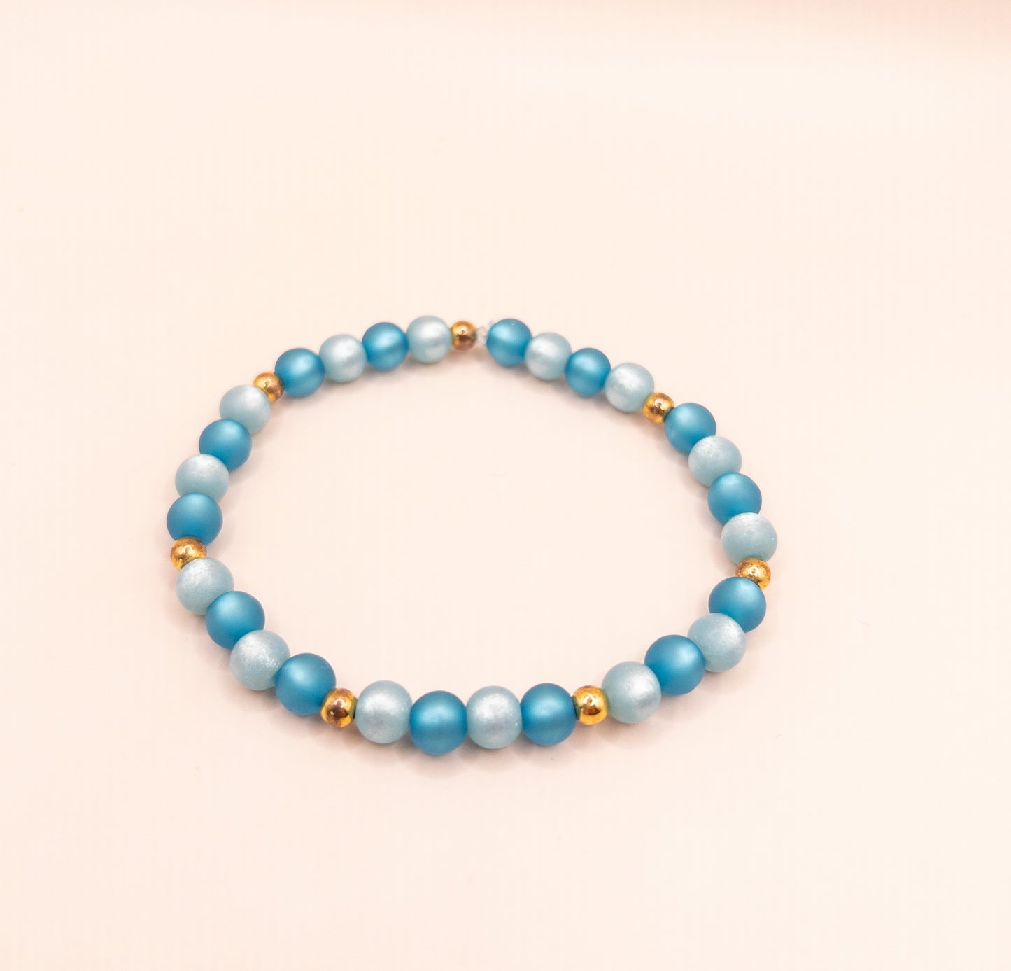 Gerbril armband kralen blauw goud