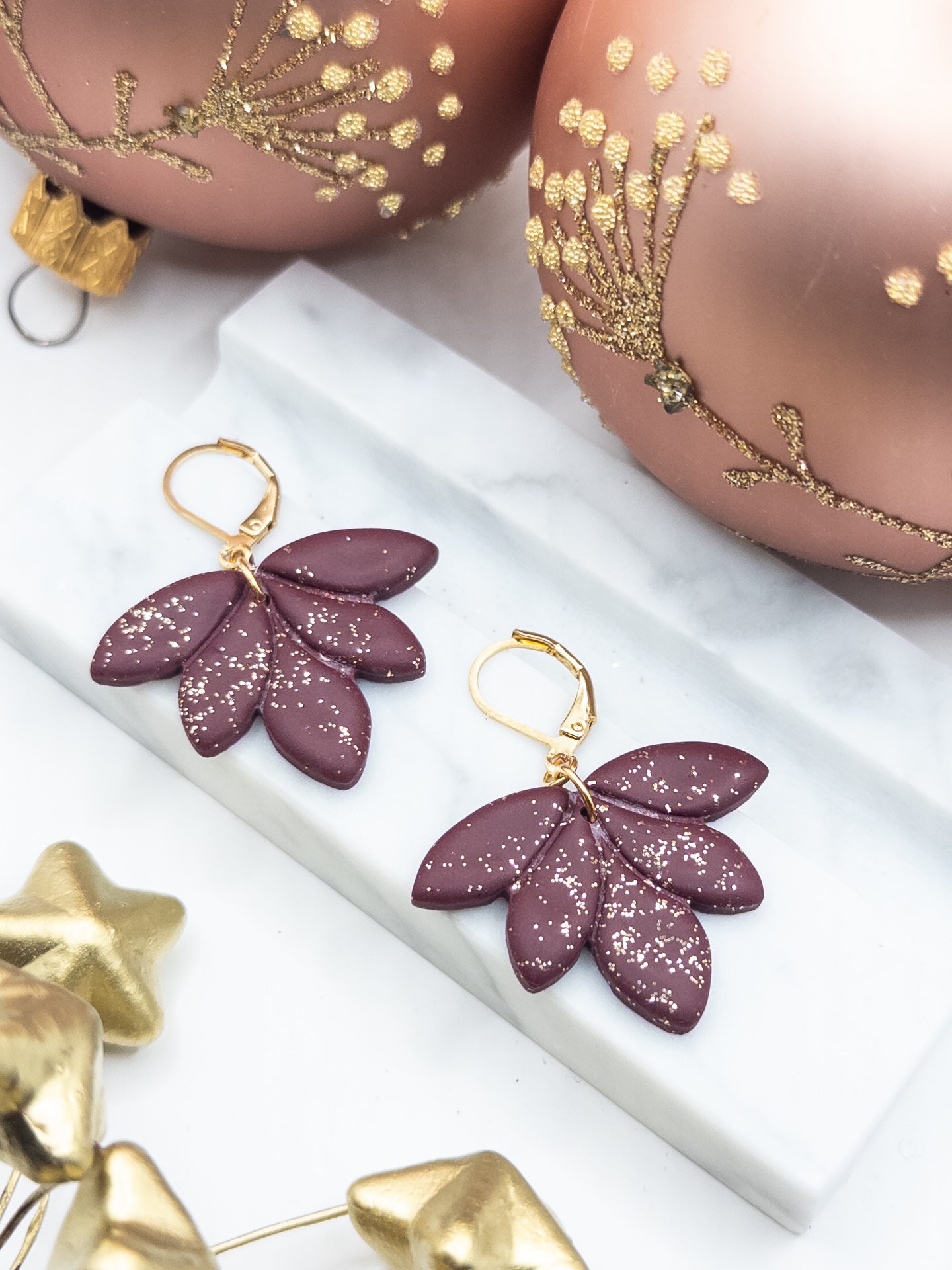 Oorbellen Lotus Bordeaux goud glitter