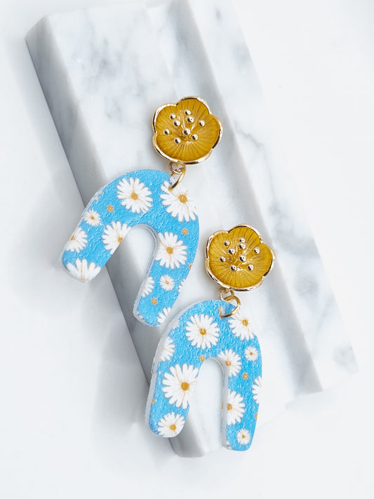 Madelief oorbellen goud blauw