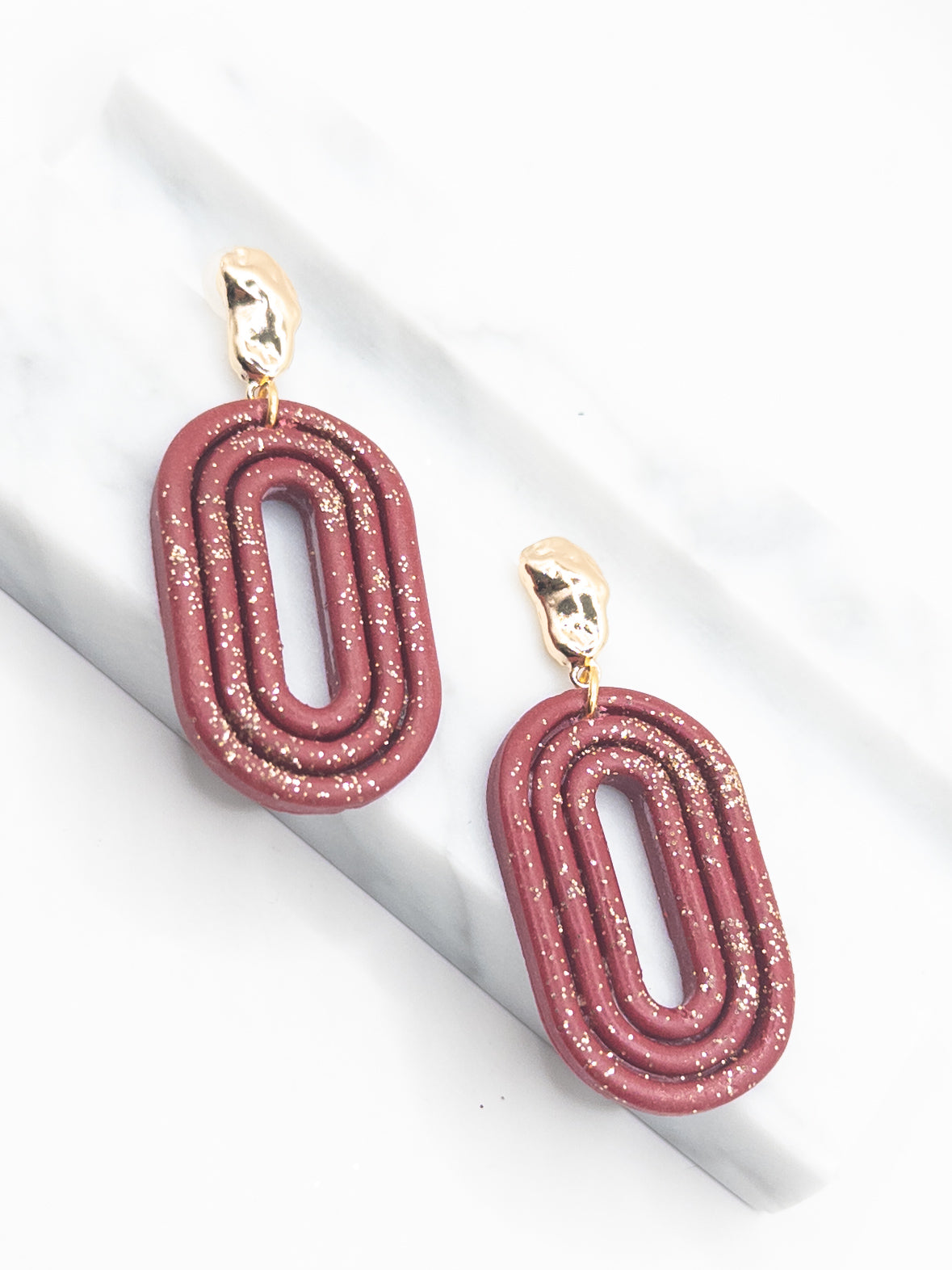 Oorbellen Oval Burgundy glitter