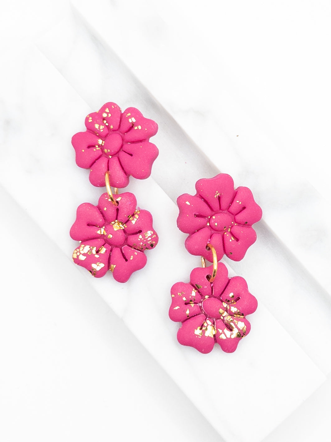 Roze bloemoorbellen met goud