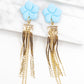 Oorbellen blauw goud bloem statement